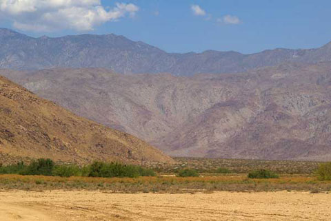 Photo taken from Clark Dry Lake looking north toward survey point Noll and the pink and blue Santa Rosa Mountains