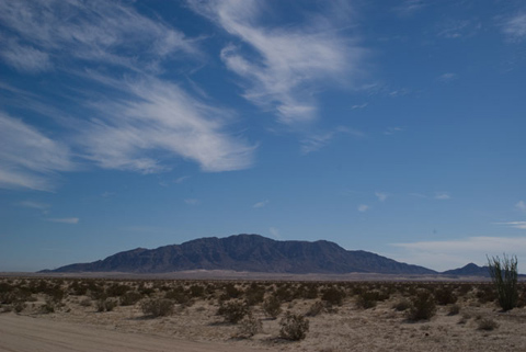 Photo of Signal Mountain, a prominent feature of the Yuha Desert, extending north and south on both sides of the international border