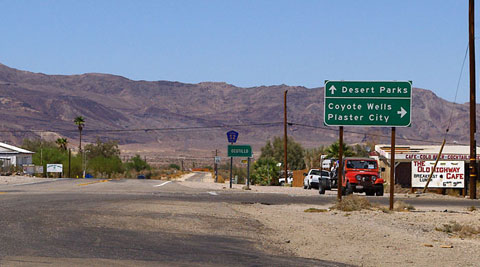 Photo of the Imperial Highway, County Road S-2, looking north through Ocotillo, California, with the Coyote Moutains in the distance