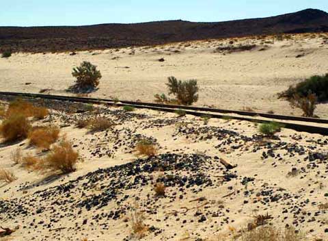 Photo of the big bend in the railroad tracks, over a sand dune, in Imperial County outside of Anza-Borrego Desert State Park